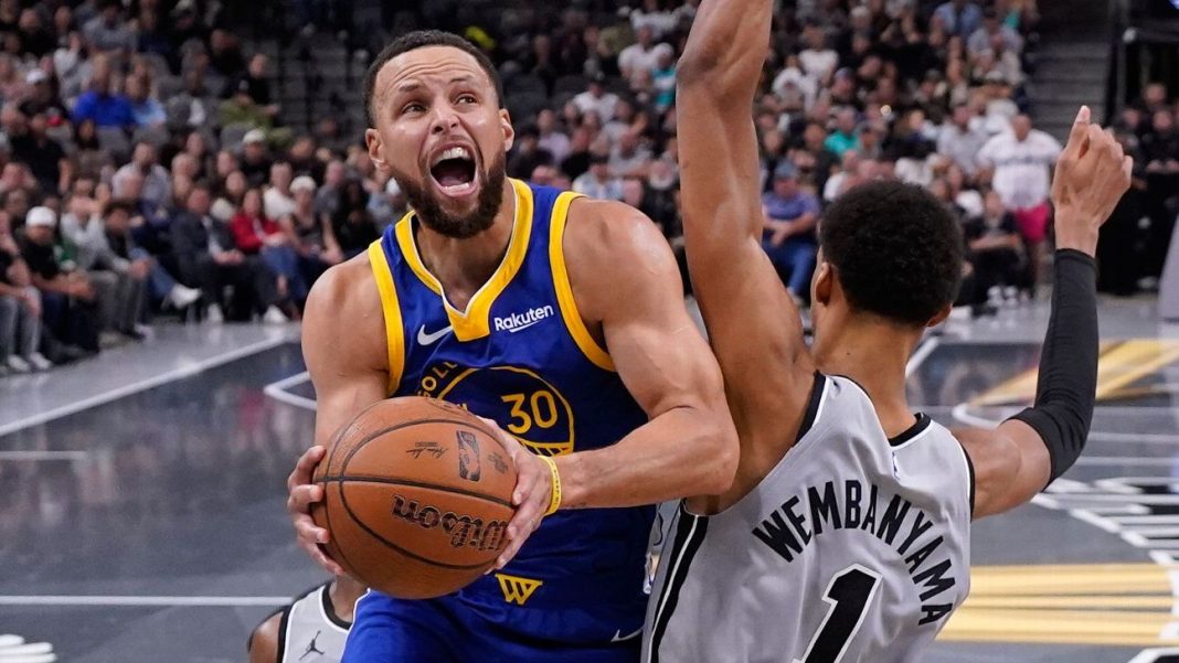 Curry torches Spurs again, rallies Warriors in 49-point night