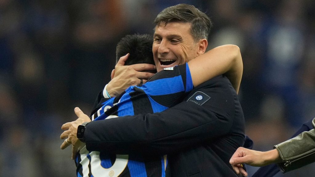 Javier Zanettie, now vice-president of Inter, embraces Lautaro Martinez