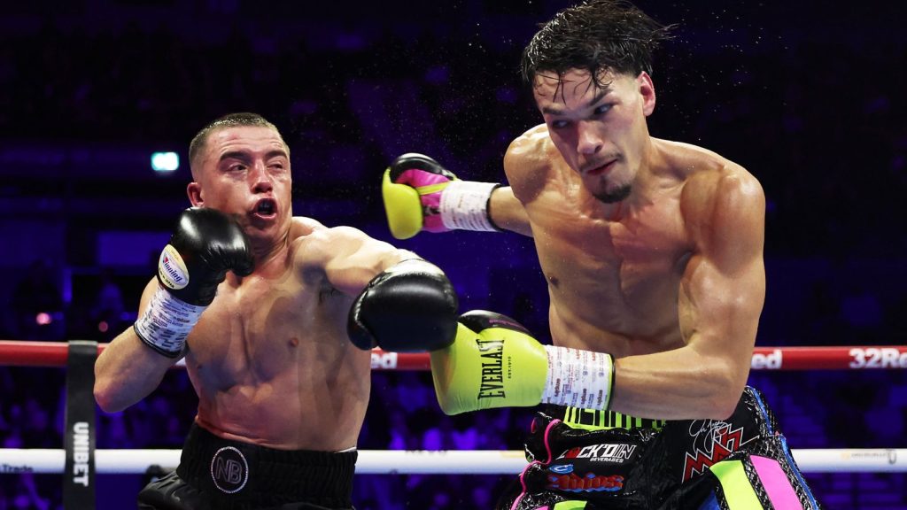 Nick Ball punches Brandon Figueroa during their WBA World Featherweight Championship match at M&S Bank Arena on February 07, 2026 in Liverpo